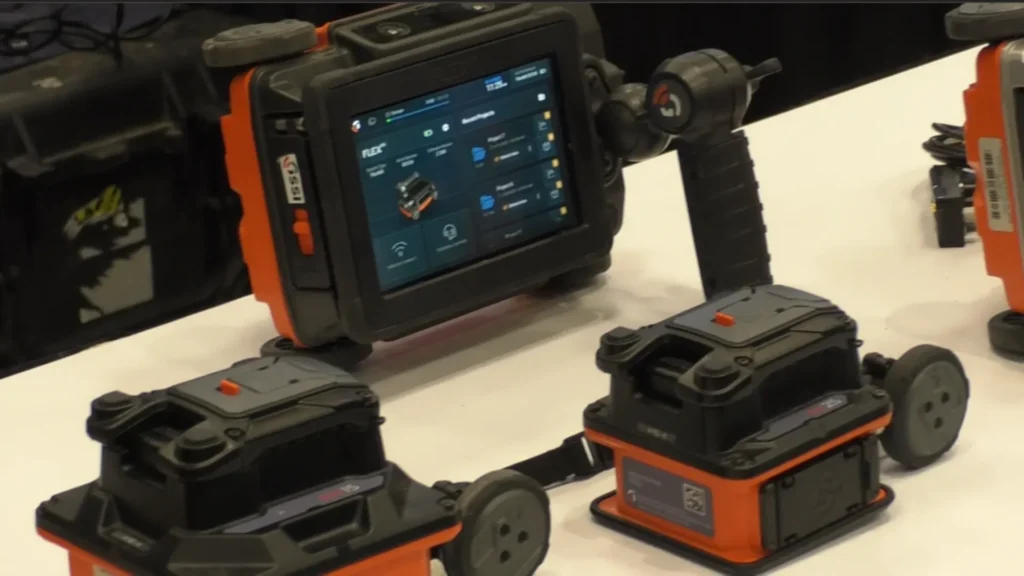GSSI's GPR FLEX GPR systems for concrete inspection, with touch screen and portable radar modules exhibited at a technology fair.