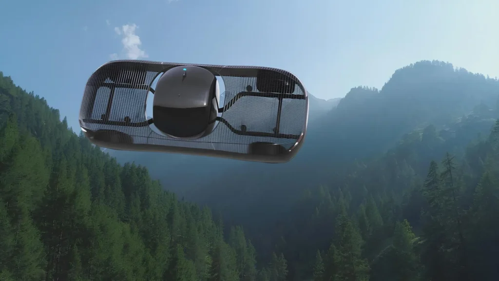 Coche volador eléctrico Model Zero Ultralight de Alef Aeronautics en vuelo sobre un paisaje montañoso boscoso.